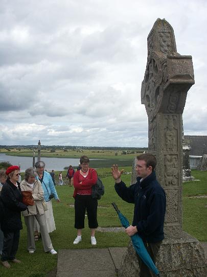 PICT0942.JPG - Sean explains the scenes depicted in the panels on the Cross (MD)