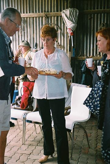 mc_fripm_pic16.JPG - Virginia Higgins serves scones in her shed (MC)