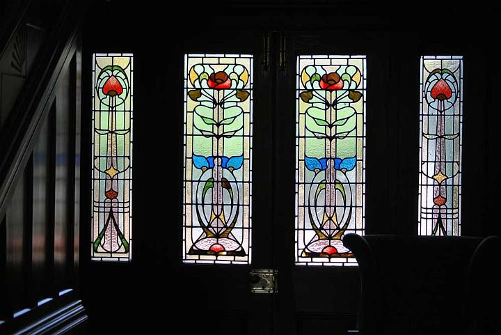 dp_sun_KangaroobieHouse9.jpg - Inside view of the stained glass doors and window lights leading to the back entry of the house (DP)