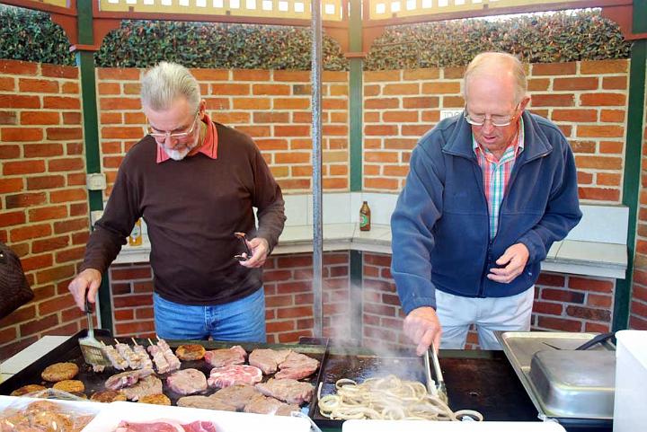 dp_sun_DuntryBBQ1.jpg - John Dalton (L) and Gavin (R) preparing the Barbie for  the feast (DP)